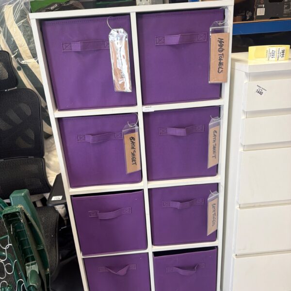 Purple fabric storage cubes for closet organization and storage.