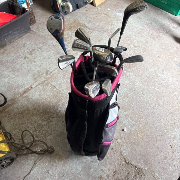 Ram golf club set with black and red bag.