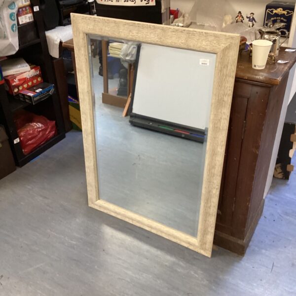 Vintage rectangular wooden mirror for home decor.