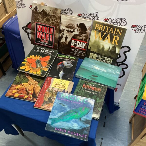 Selection of reference books including history and nature titles.