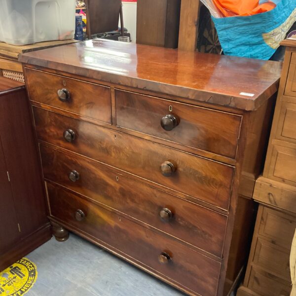 Antique Regency mahogany chest of drawers with original handles.