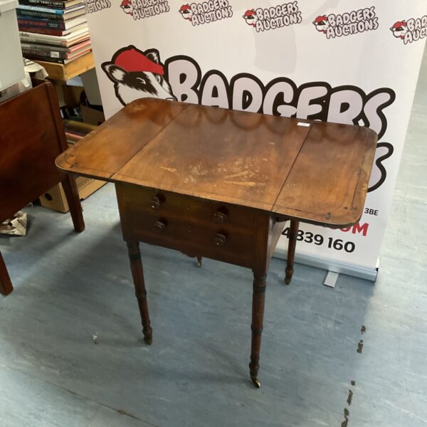 Antique Regency mahogany Pembroke table with drop leaves.