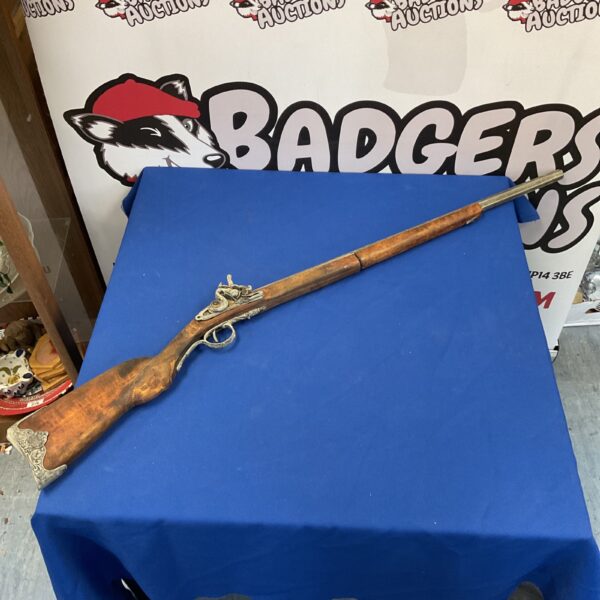 Detailed replica musket rifle for wall display.