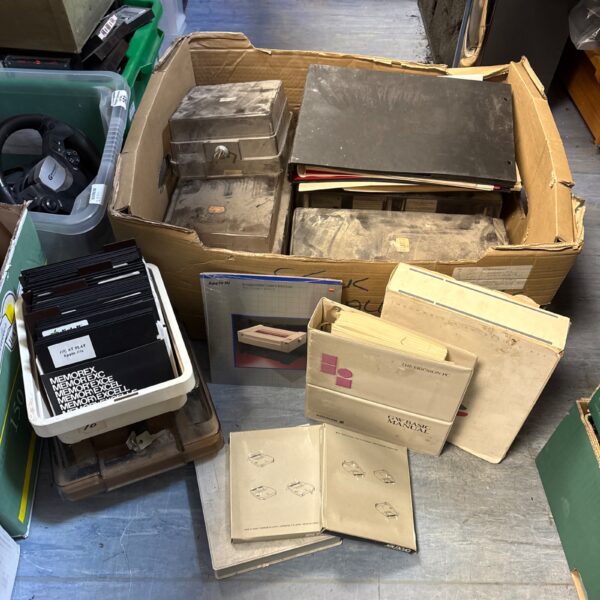 Box of vintage Apple retro computing software and games.