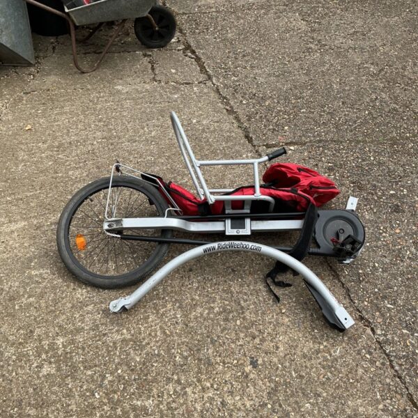 Used Rideweehoo bike trailer with metal frame and single wheel.