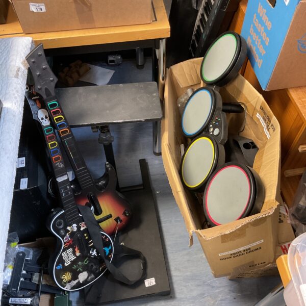 Xbox 360 Rock Band drum kit and Guitar Hero guitar controller bundle.