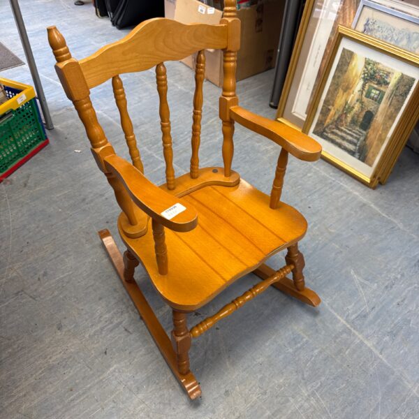 Vintage Romanian teak children’s rocking chair, front view.