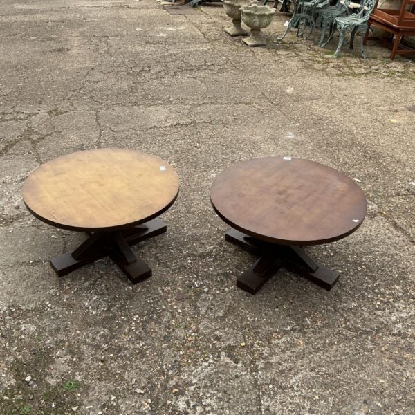 Pair of vintage round coffee tables with dark wood finish.