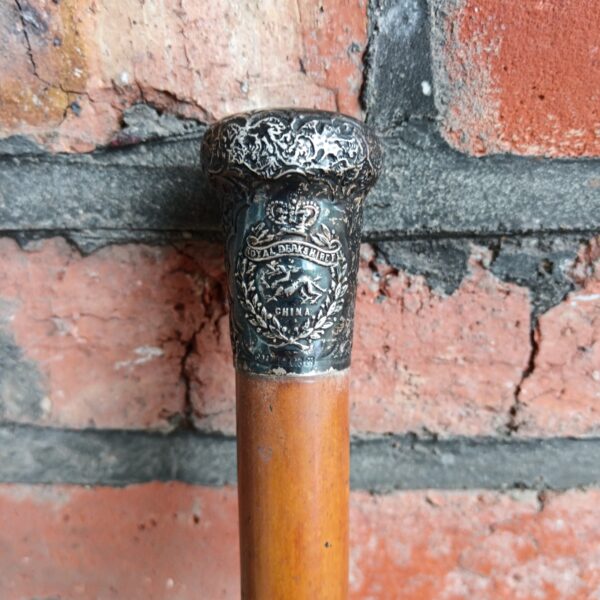 Close-up of the silver knop on a Royal Berkshire Regiment swagger cane.