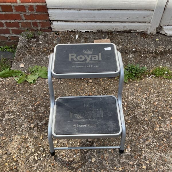 Grey Royal Deluxe caravan step with black treads for camping access.