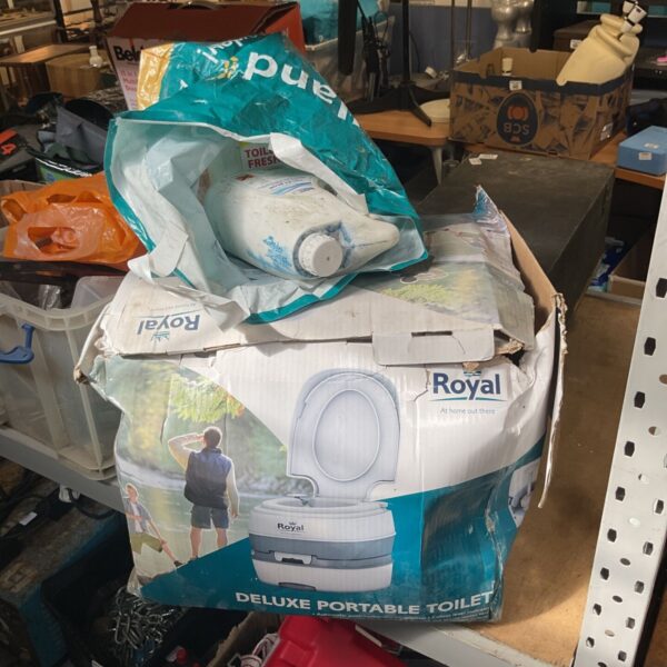 Royal deluxe portable toilet with chemical fluid packaging.
