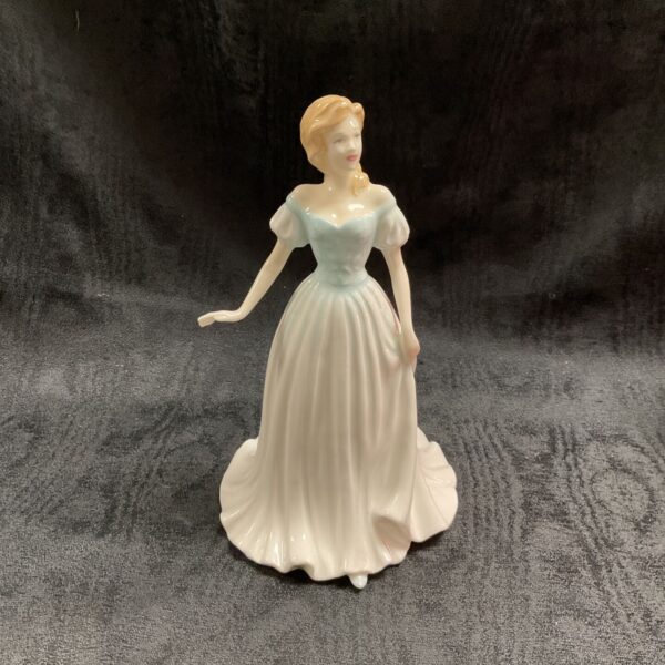 Royal Doulton Anna figurine in a pale blue dress.