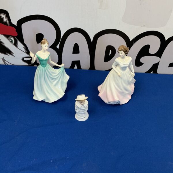 Vintage Royal Doulton bone china figure, detailed and collectible.