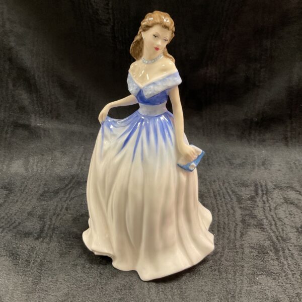 Royal Doulton Charlotte figurine in blue and white dress.