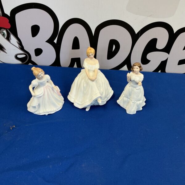 Royal Doulton bone china figures, a collectible lot of three vintage figurines.