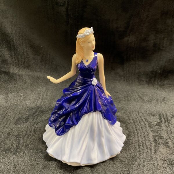 Royal Doulton September birthstone figurine in blue and white.