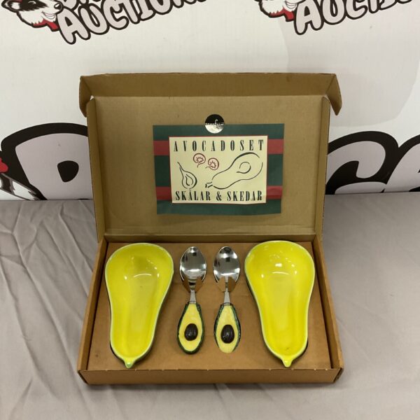 Bright yellow Sagaform avocado dish set with spoons.