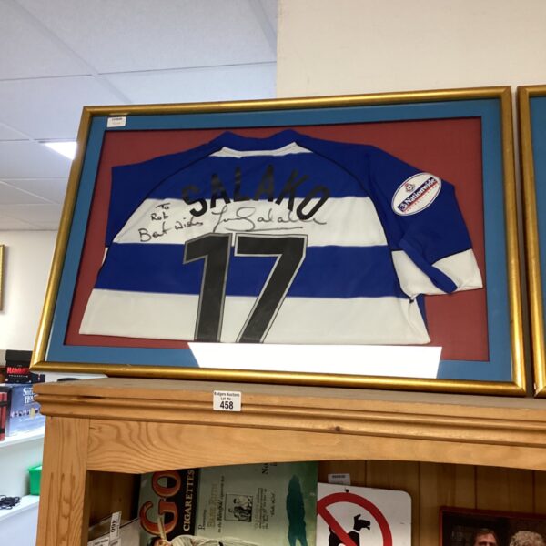 Framed signed football shirt by Salako, a collectible sports item.