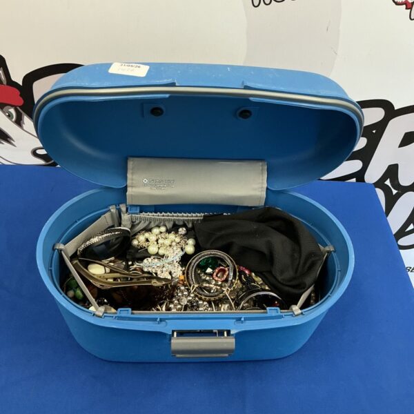 Vintage blue Samsonite jewellery case with costume jewellery inside.