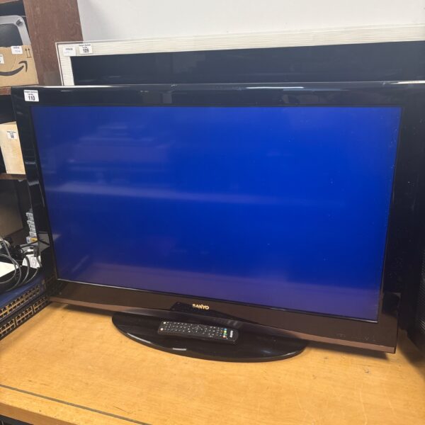 Black Sanyo 37 inch flat screen TV with remote control.