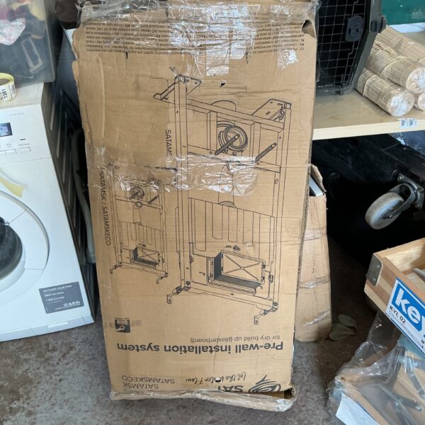 Sat concealed cistern kit with components for wall-hung toilet installation.