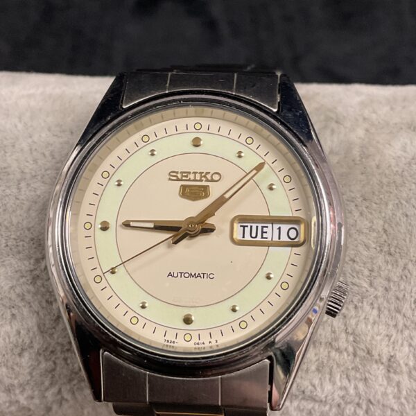 Vintage Seiko 5 automatic watch with green dial and day-date.