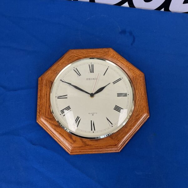 Vintage Seiko quartz wall clock with octagonal wooden case.