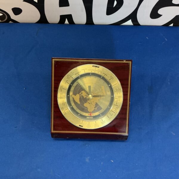 Vintage Seiko world time desk clock with rotating map.