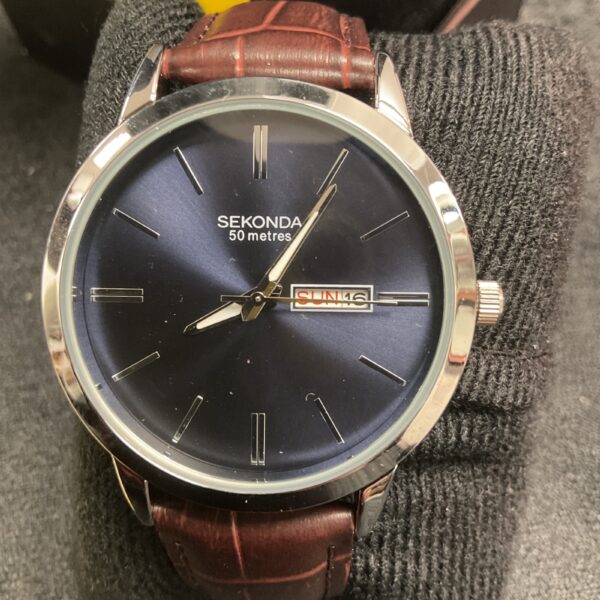 Sekonda wristwatch with a dark blue dial and leather strap.