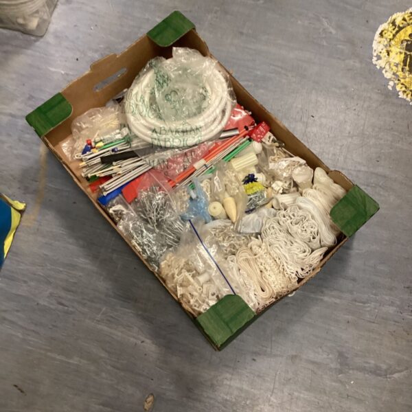 Mixed sewing supplies lot with thread and needles.