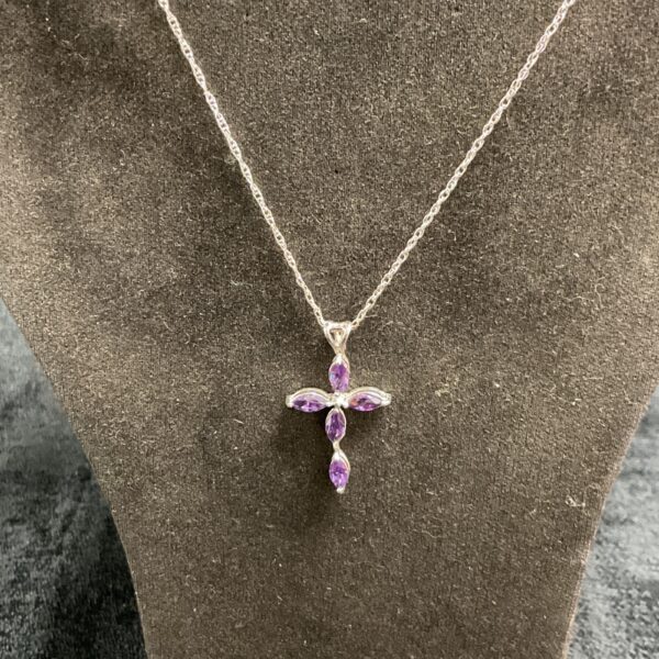 Silver amethyst cross pendant on a silver chain.