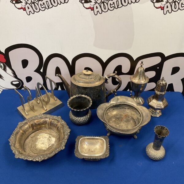 Vintage silver plate collection featuring vases and a toast rack.