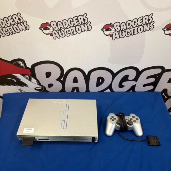 Silver Sony PlayStation 2 console with controller and cable.