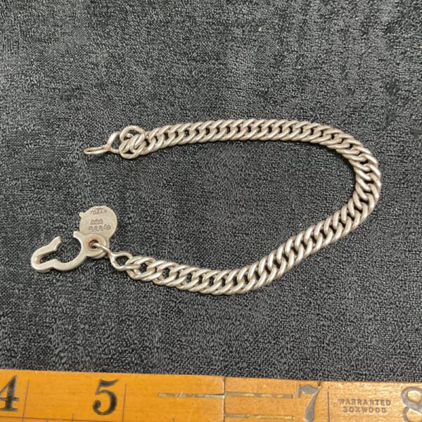 Vintage silver Tobar bracelet with hook charm.