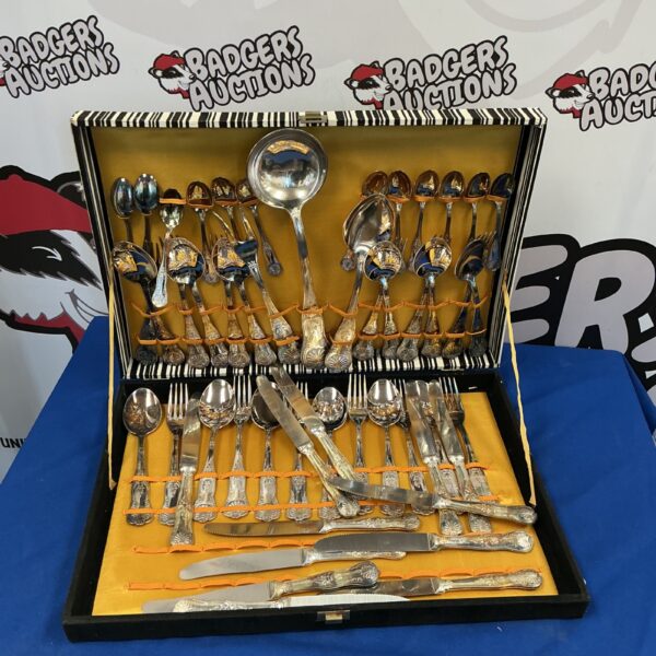 Vintage silverplate cutlery set displayed in a presentation case.