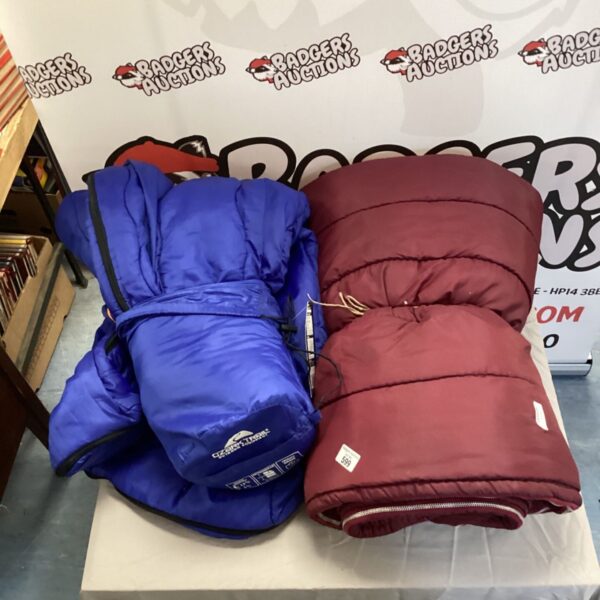 Blue and grey sleeping bags for camping and outdoor adventures.
