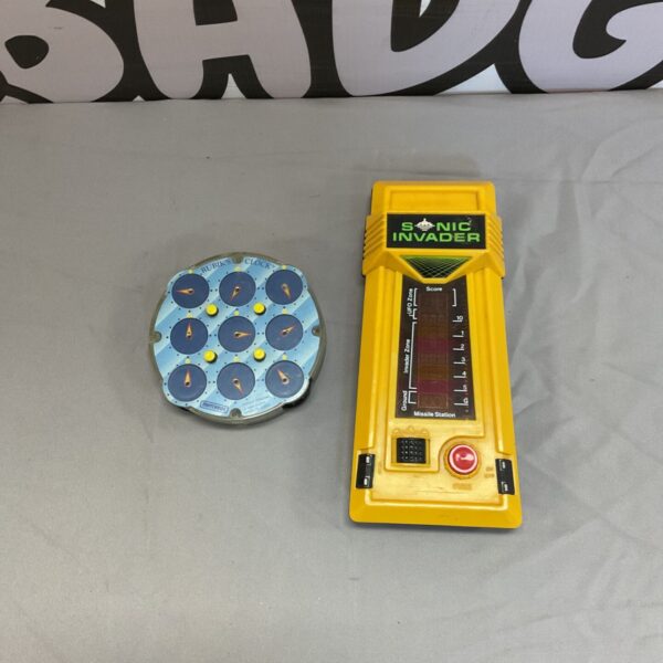 Vintage Sonic Invader game with Matchbox Rubiks Clock, retro handheld toy.