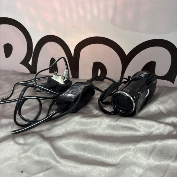 Sony Handycam HDR-CX280 digital camcorder with power adapter.
