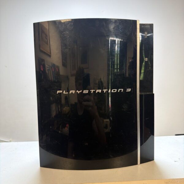 Black Sony PlayStation 3 console for retro gaming enthusiasts.