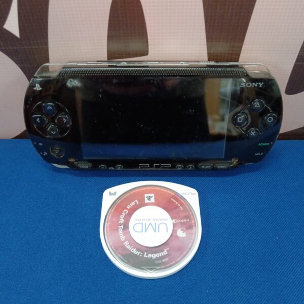 Black Sony PSP 1003 handheld gaming console, retro gaming device.