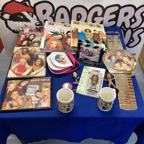 Spice Girls memorabilia lot including photo albums and clock.