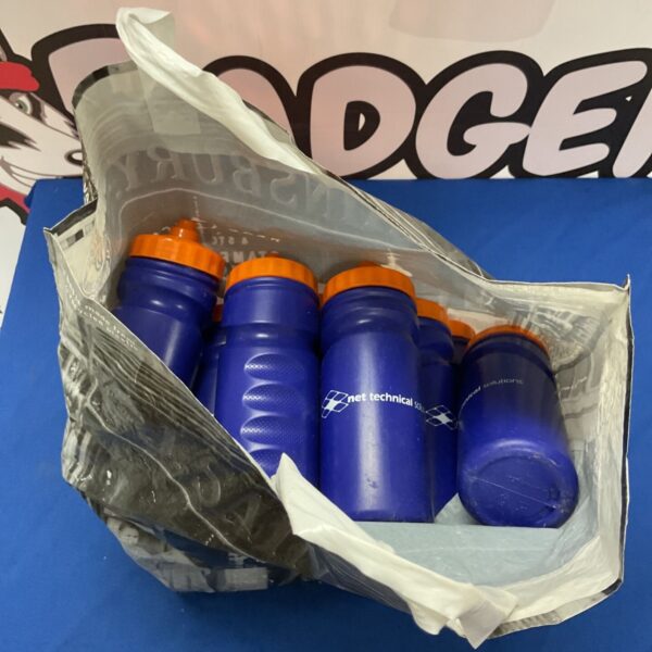 Lot of used plastic sports water bottles for hydration.