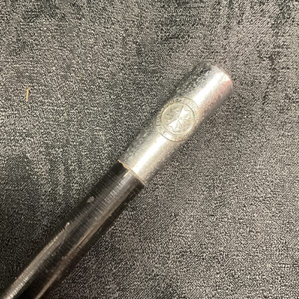 Vintage St John Ambulance swagger stick with emblem detail.