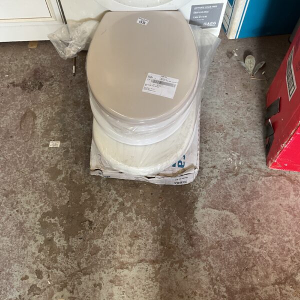 Stack of five white plastic toilet seats for bathroom plumbing.