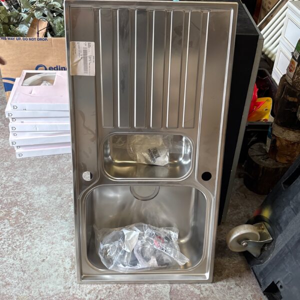 Stainless steel kitchen sink with a single drainer, used condition.