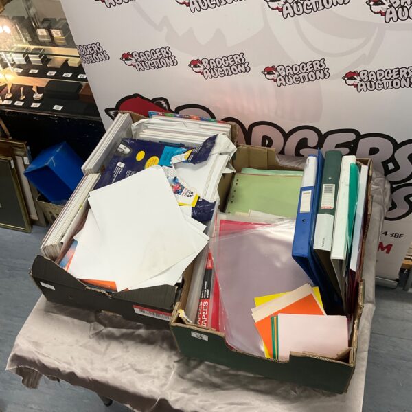 Assorted stationery bundle with folders and paper.