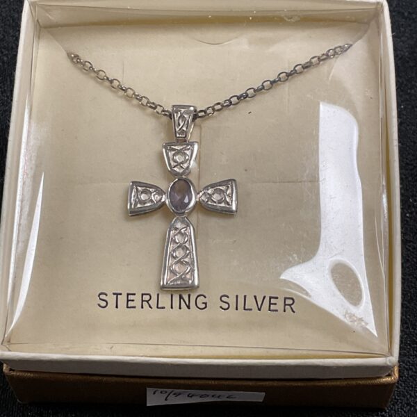 Vintage sterling silver cross pendant with amethyst gemstone.