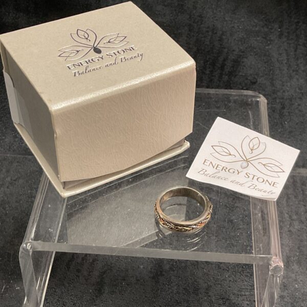 Close-up of Energy Stone sterling silver spinner ring, size N.