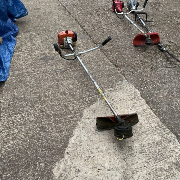 Used Stihl FS200 petrol strimmer for garden maintenance.