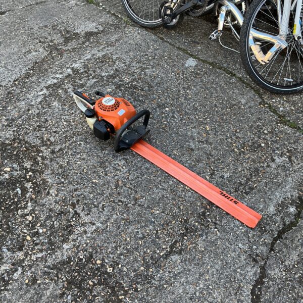 Used Stihl petrol hedge trimmer for garden and landscaping work.